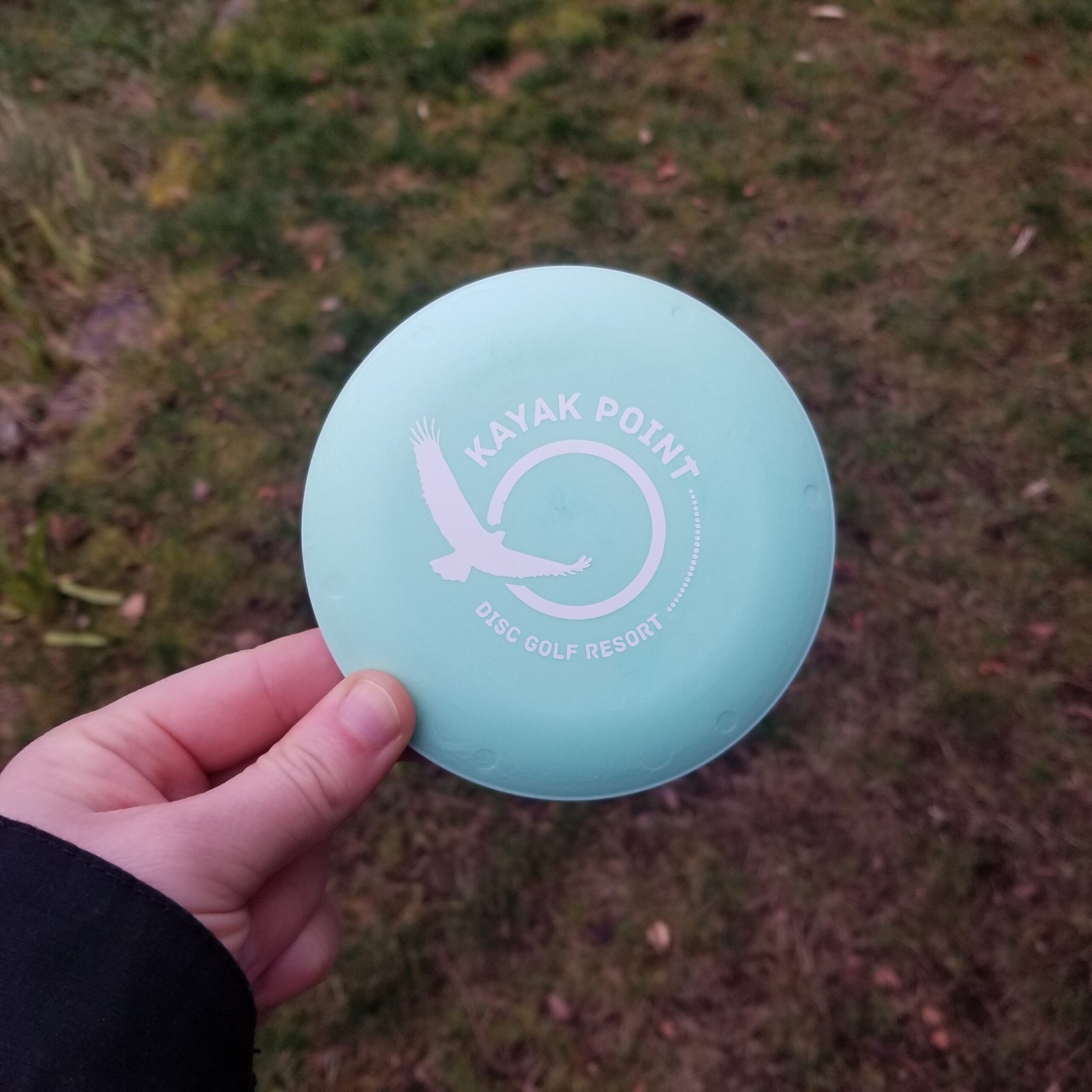 Mini disc with "Kayak Point Disc Golf Resort" logo